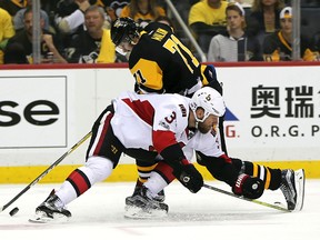 Pittsburgh Penguins centre Evgeni Malkin (71) battles for the puck with Ottawa Senators defenceman Marc Methot Thursday, May 25, 2017, in Pittsburgh. (AP Photo/Keith Srakocic)