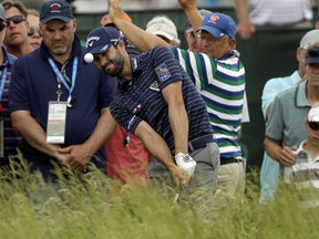 Adam Hadwin hits to the eighth green during the third round of the U.S. Open Saturday, June 17, 2017, at Erin Hills in Erin, Wis. (AP Photo/David J. Phillip)