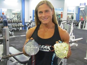 Sarnia bodybuilder Maria Mikola holds first and second place medals she has won recently. The first place finish qualified Mikola to compete in a pro world championship event  later this year.
 Paul Morden/Sarnia Observer/Postmedia Network