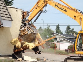 Photo by Jesse Cole Reporter/Examiner
Main Street Law partner Kendal Power helps to demolish Electric Rodeo. The building will be replaced by the new, three storey Main Street Law offices.