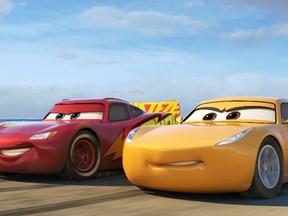 This image released by Disney shows Lightning McQueen, voiced by Owen Wilson, left, and Cruz Ramirez, voiced by Cristela Alonzo in a scene from "Cars 3." (Disney-Pixar via AP)