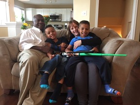 Left to right: Felix, Ascemian (Ace), Arleigh and Nyameke Assie in their Winnipeg home. Born a partial left hand amputee, Ascemian Assie is a member of The War Amps Child Amputee (CHAMP) Program, and through his role as a Safety Ambassador, he encourages kids to be aware of road signs and moving vehicles in their neighbourhoods.