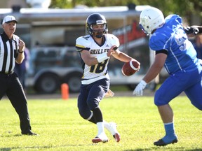 Grande Prairie Drillers QB Rylee Peters, left, tries to get away from an incoming tackle against the St. Albert Stars in Alberta Football League action on Saturday June 17, 2017 at Legion Field in Grande Prairie, Alta. Logan Clow/Grande Prairie Daily Herald-Tribune/Postmedia Network