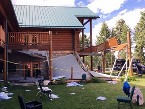 In this image taken Saturday, June 17, 2017, debris is strewn about at the scene where a second-story deck collapsed at a lodge near Lakeside, Mont. (Firefighter/Engineer Mathew Borlandelli/Somers/Lakeside Fire Department via AP)