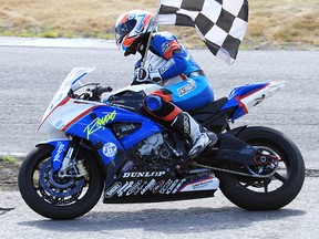 Michael Leon flies the checker following his victory Sunday in the Pro Superbike finals of Round 3 of the RACE Super Series at Shannonville Motorsport Park. (Don Empey photo)