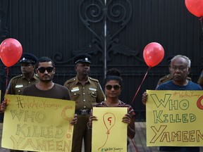 Maldivians residents living in Sri Lanka taking part in a demonstration against the murder of liberal blogger Yameen Rasheed outside the Maldivian High Commission in Colombo. The father of murdered blogger Yameen Rasheed in the Maldives accused police on June 9, 2017 of trying to cover up the case, and appealed to the United Nations for an investigation. (S. Kodikaraishara/AFP/Getty Images)