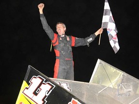 Picton driver Chris Jones celebrates his SOS victory Saturday at Brighton Speedway. (Rod Henderson photo)