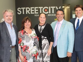 StreetCity Realty officially opened its Sarnia branch on June 9 with a ribbon-cutting ceremony and tours of its new facility. From left to right: Mayor Mike Bradley, StreetCity branch manager Donna Mathewson, StreetCity co-founders Mary Johnson and Costa Poulopoulos and Peerage Realty Partners' Don Kottick.
CARL HNATYSHYN/SARNIA THIS WEEK