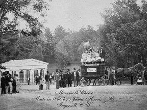 An 1866 photograph shows the Big Cheese ? `Mammoth Cheese,? as it was known in the day ? crowned by a small crowd ? as a horse team prepares to haul it away. (Tourism Oxford)