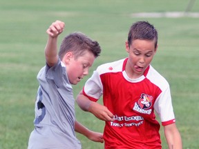Cy Bergsma (right) of the Mitchell 11U soccer team battles for the loose ball during action against visiting Thorndale on Thursday, June 15. The Herons were full value for a 10-4 win. ANDY BADER/MITCHELL ADVOCATE
