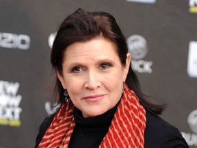 This April 7, 2011 file photo shows Carrie Fisher at the 2011 NewNowNext Awards in Los Angeles. A coroner's report released Monday, June 19, 2017, shows that Fisher had cocaine, ecstasy and heroin in her system when she became ill on a
London to Los Angeles flight in December. The reports states it is difficult to pinpoint when the drugs were taken and their impact on Fisher's Dec. 27, 2016 death, which was caused by sleep apnea and other undetermined factors, Fisher's autopsy report states. (AP Photo/Chris Pizzello, File)