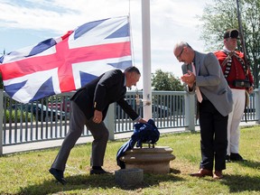 Taylor Bertelink/For The Intelligencer
Harry Danford and Mayor Taso Christopher unveiled the new plaque at this year’s commemorative ceremony honouring United Empire Loyalist Day in Belleville on Monday. Danford was the MPP at the time of the official declaration. "We are indebted to his efforts on behalf of our Loyalist heritage," said Peter Johnson, branch president for the Bay of Quinte Branch United Empire Loyalists Association of Canada.