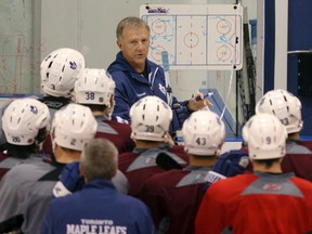 Former Maple Leafs coach Ron Wilson, seen during a practice in 2010, will be inducted into the U.S. Hockey Hall of Fame. (Jack Boland/Toronto Sun)