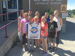 BRUCE BELL/THE INTELLIGENCER
Grade 5 students and staff members at Holy Name of Mary Catholic School in Marysville show of the banner they received from OPHEA for promoting healthy and active lifestyles. Pictured are (back row from left) teacher Maureen Murphy, Ben Buxton, Kassie Cummins, Bradley Nitschke and teacher Jenna Trousdale. In the front row (from left) Lauren Kennelly, Navy Hill, Trysta Brennan, Abbie Maracle and Tommy Forbes.