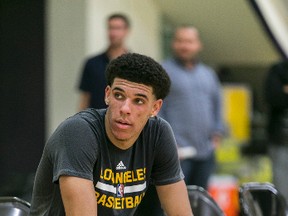 In this June 7, 2017, file photo, University of California Los Angeles guard Lonzo Ball relaxes after a closed Los Angeles Lakes pre-draft workout in El Segundo, Calif. (AP Photo/Damian Dovarganes, File)
