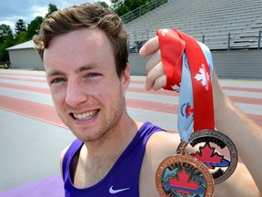 Distance runner Kevin Blackney shows his silver and bronze medals from the Canadian Championships.
MORRIS LAMONT/THE LONDON FREE PRESS /POSTMEDIA NETWORK