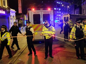 Police cordon off a street in the Finsbury Park area of north London after a vehichle hit pedestrians, on June 19. (AFP PHOTO)