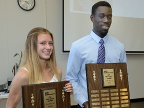 Laura Parkinson of Catholic Central and Ruach Padhal of John Paul II show off the hardware after being named 2017 winners of the Bob Gage Award as top track and field athletes in Thames Valley Regional Athletics on Monday. (MORRIS LAMONT, The London Free Press)