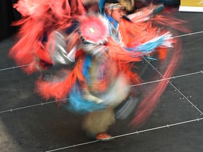 A dancer performs at the National Aboriginal Day kickoff at City Centre Mall in Edmonton on June 19, 2017.