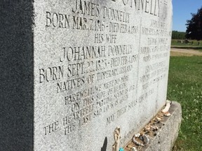 Their murders still chilling after all these years, the five slain members of the Donnelly family are remembered on a stark grave marker in a churchyard in Lucan, north of London. (Postmedia News)