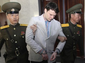 In this March 16, 2016, file photo, American student Otto Warmbier, centre, is escorted at the Supreme Court in Pyongyang, North Korea. Warmbier, an American college student who was released by North Korea in a coma last week after almost a year and a half in captivity, died Monday, June 19, his family said. (AP Photo/Jon Chol Jin, File)