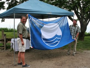 Bluewater Deputy Mayor Jim Fergusson and Mayor Tyler Hessel proudly pose with Bayfield’s Blue Flag.