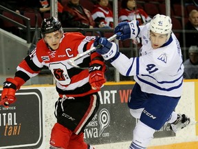 Nicolas Hague (right) battles for position during the first period as the Ottawa 67's take on the Mississauga Steelheads in Ontario Hockey League playoff action. Hague is in the mix to be the Jets first pick in the NHL draft. Wayne Cuddington/Postmedia Files