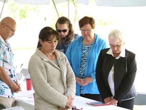 A moment of silence was held at the Workers' Memorial Day service at the Mine Mill campground in Sudbury, Ont. on Tuesday June 20, 2017. John Lappa/Sudbury Star/Postmedia Network