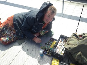 Megan Glover/For The Whig-Standard 
Artist Ben Wilson taking ‘chewing gum painting’ commissions on the Millennium Bridge in London, England on June 8, 2017.