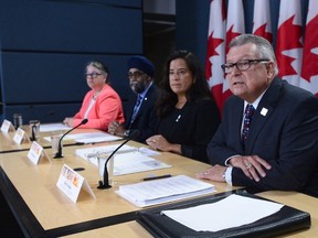 Ralph Goodale, Minister of Public Safety and Emergency Preparedness, Jody Wilson-Raybould, Minister of Justice, Harjit Sajjan, Minister of National Defence, and Diane Lebouthillier, Minister of National Revenue, make a national security-related announcement at the National Press Theatre in Ottawa on Tuesday, June 20, 2017. THE CANADIAN PRESS/Sean Kilpatrick