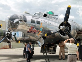 Crews inspect the vintage Second World War-era bomber before take-off. (Carl Hnatyshyn/Postmedia Network)