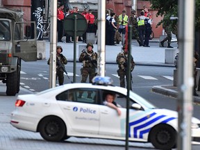 Belgian Army soldiers and police patrol outside Central Station after a reported explosion in Brussels on Tuesday, June 20, 2017. (AP Photo/Geert Vanden Wijngaert)