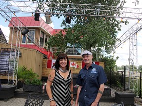 Paddy Flaherty's co-owners Angelyn Smolders and Scott Dargie stand in front of their outdoor stage. City council recently voted to allow six noise-bylaw exempt dates at the venue. (Tyler Kula/Sarnia Observer/Postmedia Network)