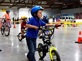 A section of the track teaches children to dismount bikes to walk across a crosswalk.