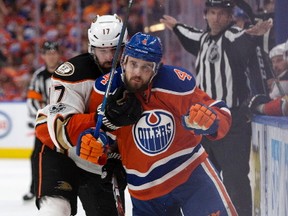 The Edmonton Oilers Kris Russell (4) battles the Anaheim Ducks Ryan Kesler (17) during third period NHL action at Rogers Place, in Edmonton Saturday April 30, 2017.