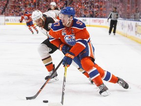 Anaheim Ducks' Ryan Getzlaf (15) chases Edmonton Oilers' Connor McDavid (97) during the second period in game six of a second-round NHL hockey Stanley Cup playoff series in Edmonton on Sunday, May 7, 2017.