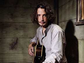 Chris Cornell plays guitar during a portrait session at The Paramount Ranch in Agoura Hills, Calif., on July 29, 2015. (Casey Curry/Invision/AP/Files)