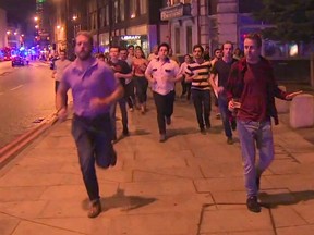 In this image taken from video footage, people run from the scene of attack in London, late Saturday, June 3, 2017. (Sky news via AP)