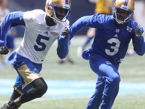 CFL Winnipeg Blue Bombers receiver, #5, L'Damian Washington, runs with #3 Kevin Fogg, in Winnipeg. Tuesday, June 20, 2017. Chris Procaylo/Winnipeg Sun/Postmedia Network