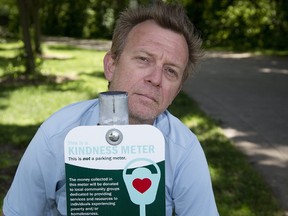 Lincoln McCardle, who spearheaded London?s Kindness Meter project, shows what?s left of the Ivey Park meter beheaded by thieves. (Derek Ruttan/The London Free Press)