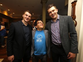 Ari Margolis of Good Foot, a non-profit operation that trains people with disabilities such as Autism into the workforce as couriers, meets Leafs' Maple Leafs' Zach Hyman (left) and James van Riemsdyk at a fundraiser for the charity at Ultimate Leafs Fan Mike Wilson's house in Toronto on Tuesday, June 20, 2017. (MICHAEL PEAKE/TORONTO SUN)