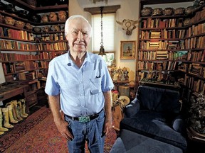 In this July 4, 2014 photo, Forrest Fenn poses at his Santa Fe, N.M., home. New Mexico's top law enforcement officer is asking Fenn, the author and antiquities dealer who inspired thousands to comb remote corners of the West in vain for a chest of gold and jewels to end the treasure hunt. (Luis Sanchez Saturno/Santa Fe New Mexican via AP)