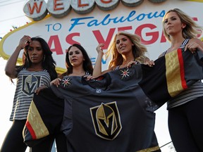 Models unveil the expansion Vegas Golden Knights' new jersey in Las Vegas on Tuesday, June 20, 2017. (AP Photo/John Locher)