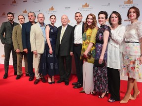 The cast and producers of Downton Abbey on the red carpet at the launch of an exhibition about the television series at the Marina Bay Sands on Wednesday, June 21, 2017, in Singapore. (AP Photo/Joseph Nair)