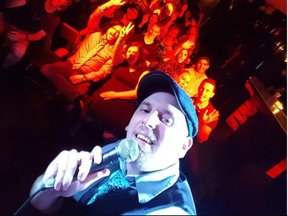 Caption- Sam Norton takes a selfie with the phone he used to call Steve Hofstetter who performed his stand- up set over loudspeaker at City At Night on June 18. (Courtesy Steve Hoffstetter)