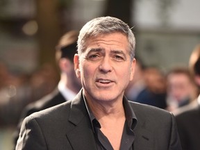 This file photo taken on May 17, 2015 shows actor George Clooney posing on the carpet arriving to attend the European premiere of the film 'Tomorrowland: A World Beyond' in London. Diageo, the British maker of alcoholic drinks, said Wednesday it had agreed to buy Casamigos, an upscale tequila brand co-founded by Hollywood star George Clooney, in a deal worth up to $1 billion. (LEON NEALLEON NEAL/AFP/Getty Images)