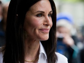 US actress Courtney Cox poses for photographers upon arrival at the Ivor Novello awards in central London, on May 19, 2016. (JUSTIN TALLIS/AFP/Getty Images)