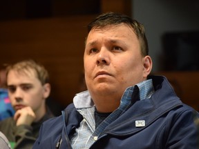 Ron Quintal, Rural Coalition spokesperson and president of the Fort McKay Métis, looks up at a screen displaying a presentation on the rural water and sewer program, in council in Fort McMurray, Alta. on Tuesday, June 20, 2017. Cullen Bird/Fort McMurray Today/Postmedia Network