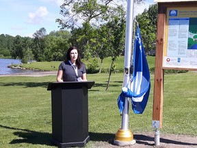 Kelsey Scarfone, Blue Flag program coordinator with Environmental Defence, speaks during a ceremony to raise a Blue Flag at Moonlight Beach on Wednesday. The designation is awarded to beaches that meet criteria in water quality, environmental education and management, and safety and services. (Photo supplied)