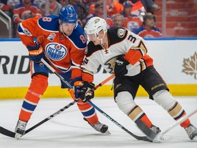 Griffin Reinhart of the Edmonton Oilers, makes his playoff debut against Jakob Silfverberg of the Anaheim Duck in Game 6 in the second round of NHL playoffs at Rogers Place on May 7, 2017.